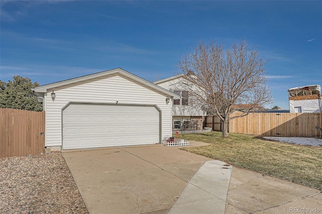 ranch-style house featuring a garage and a front lawn