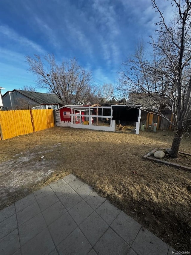 back of house with an outbuilding