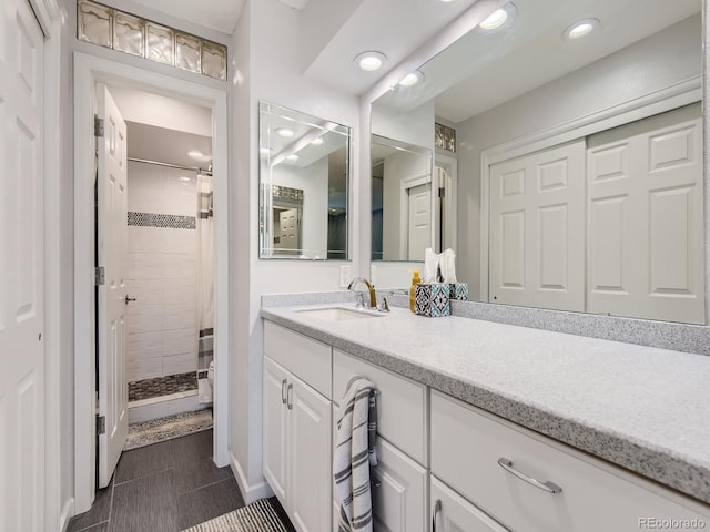 bathroom featuring wood-type flooring, walk in shower, vanity, and toilet