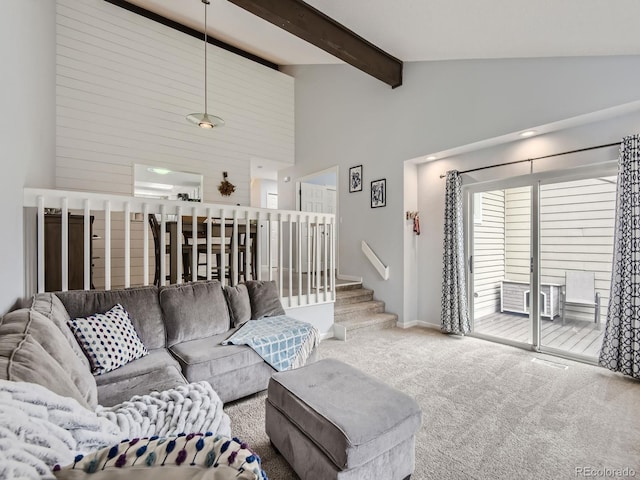 living room featuring high vaulted ceiling, beam ceiling, and carpet flooring