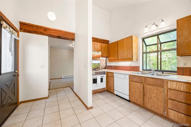 4717 Tantra Dr Unit G5, Boulder, CO 80305 - kitchen featuring white dishwasher, under cabinet range hood, stove, light countertops, and a towering ceiling