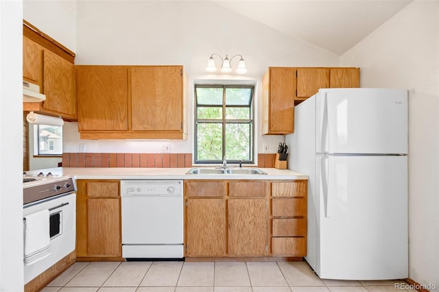 4717 Tantra Dr Unit G5, Boulder, CO 80305 - kitchen featuring white appliances, light countertops, lofted ceiling, under cabinet range hood, and light tile patterned floors
