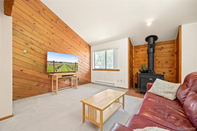 4717 Tantra Dr Unit G5, Boulder, CO 80305 - living room featuring baseboard heating, a wood stove, and wooden walls