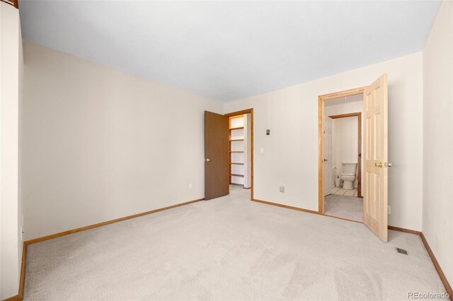 4717 Tantra Dr Unit G5, Boulder, CO 80305 - unfurnished bedroom featuring light carpet and ensuite bathroom