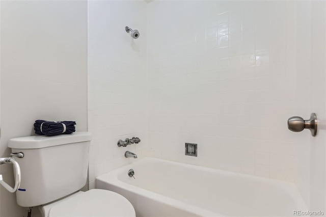 bathroom featuring toilet and tiled shower / bath combo