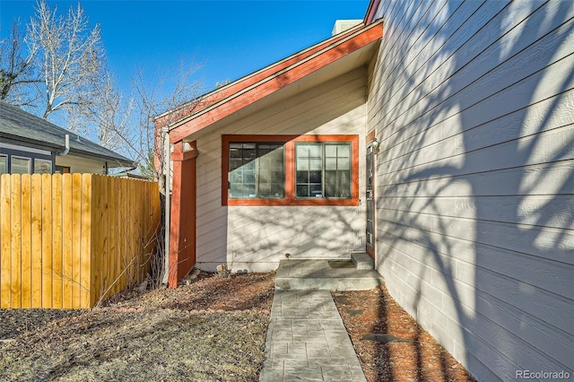 view of property exterior with fence