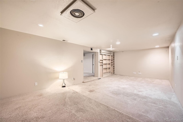 spare room with recessed lighting, visible vents, and carpet