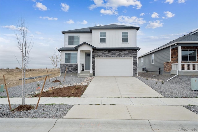 13467 Valentia St, Thornton, CO 80602 - view of front of house with stone siding, a garage, concrete driveway, and board and batten siding