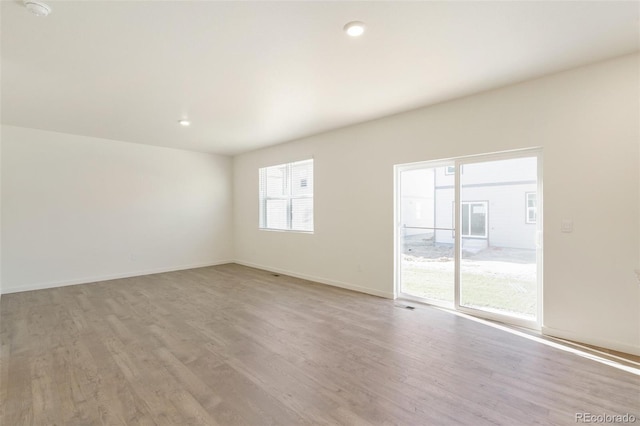 13467 Valentia St, Thornton, CO 80602 - unfurnished room with light wood finished floors, a smoke detector, and recessed lighting