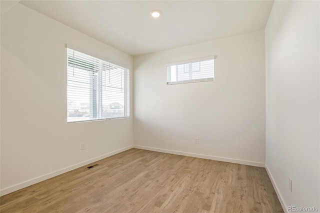 13467 Valentia St, Thornton, CO 80602 - empty room with baseboards and light wood finished floors