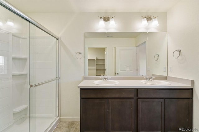 13467 Valentia St, Thornton, CO 80602 - full bathroom featuring a shower stall and double vanity