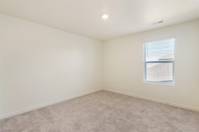13467 Valentia St, Thornton, CO 80602 - empty room with light carpet and recessed lighting