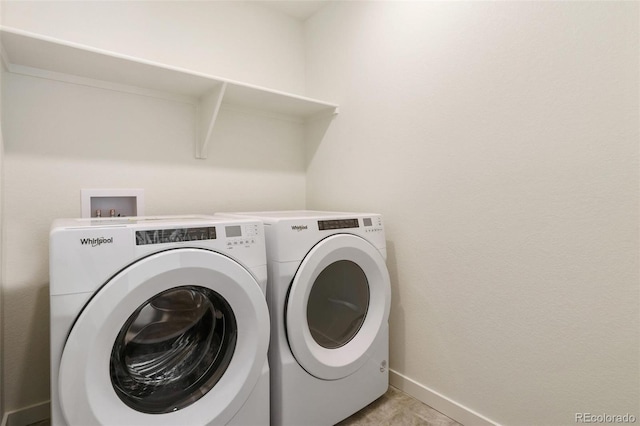 13467 Valentia St, Thornton, CO 80602 - laundry area with washer and clothes dryer and baseboards