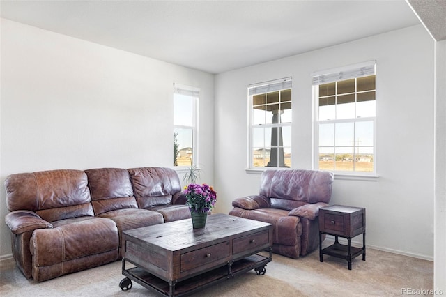 carpeted living room featuring plenty of natural light