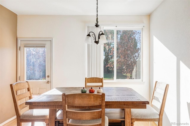 dining room with a notable chandelier