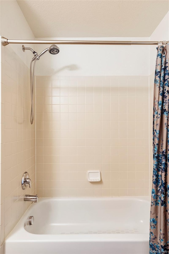 bathroom featuring shower / bathtub combination with curtain