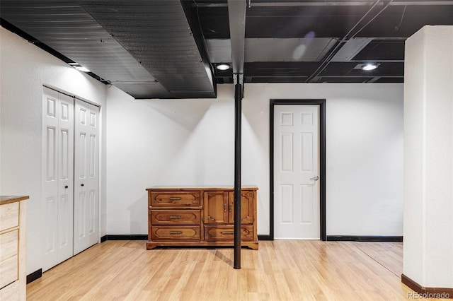 basement featuring light wood-type flooring