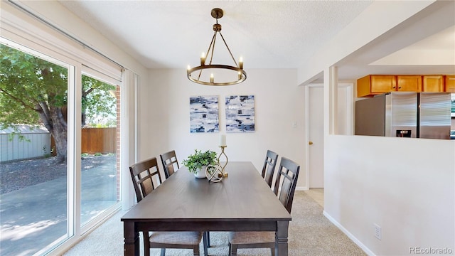 1820 W 104th Pl, Northglenn, CO 80234 - dining room with light colored carpet and a chandelier