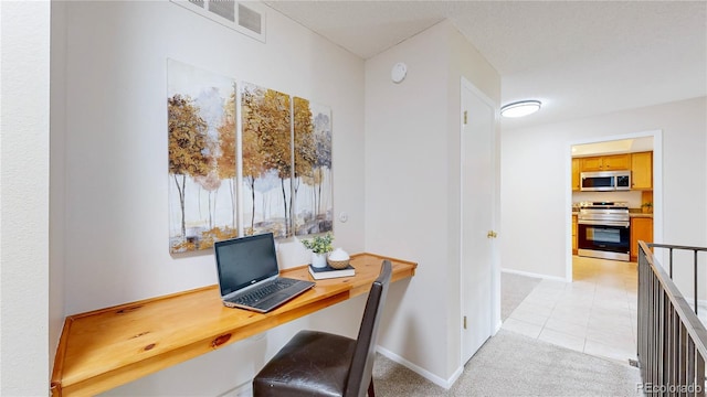 1820 W 104th Pl, Northglenn, CO 80234 - office area featuring light tile patterned flooring and light carpet