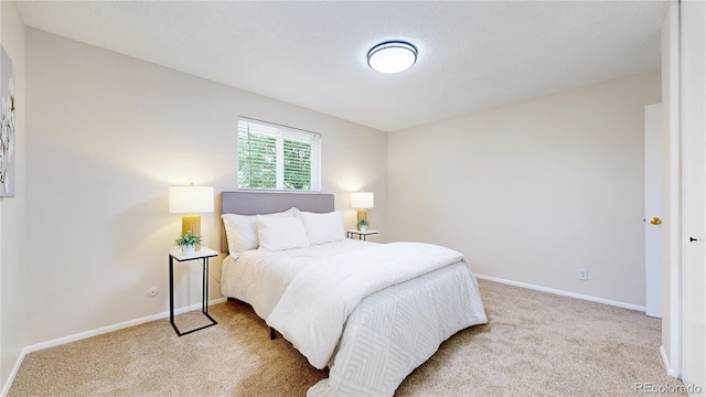 1820 W 104th Pl, Northglenn, CO 80234 - bedroom featuring light carpet and baseboards