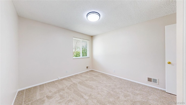 1820 W 104th Pl, Northglenn, CO 80234 - carpeted empty room with a textured ceiling and baseboards
