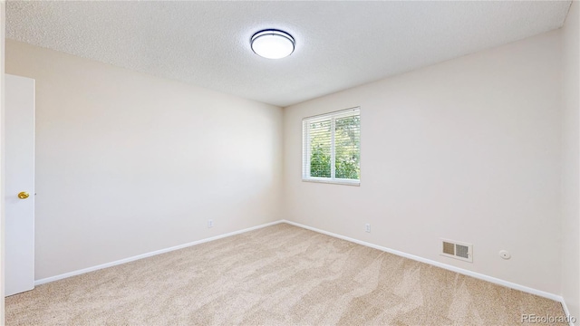 1820 W 104th Pl, Northglenn, CO 80234 - carpeted empty room featuring baseboards and a textured ceiling