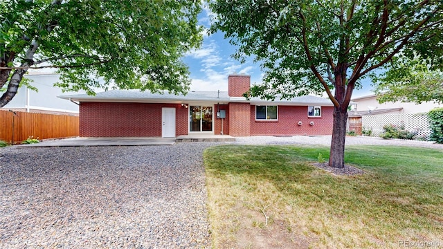 1820 W 104th Pl, Northglenn, CO 80234 - ranch-style house featuring a chimney, brick siding, and a patio