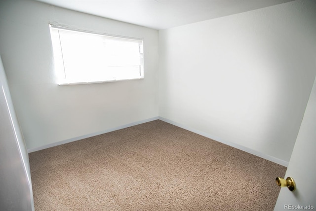 empty room featuring baseboards