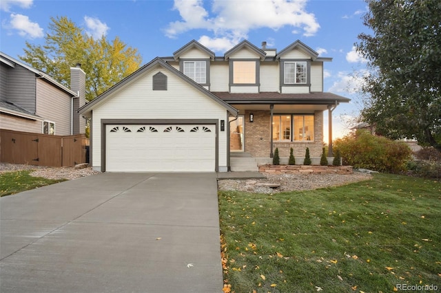 view of front of house featuring covered porch, a front lawn, and a garage