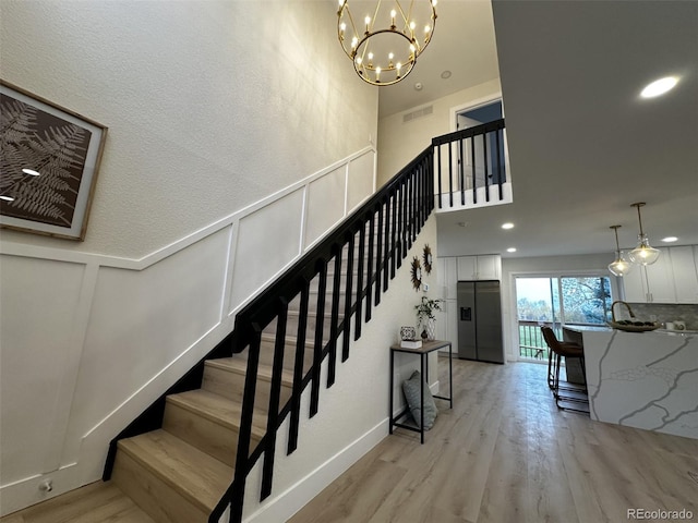 stairs with wood-type flooring