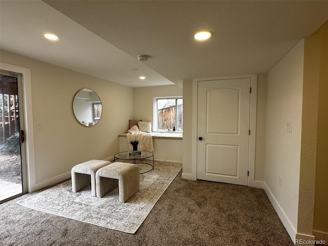 unfurnished room featuring dark colored carpet