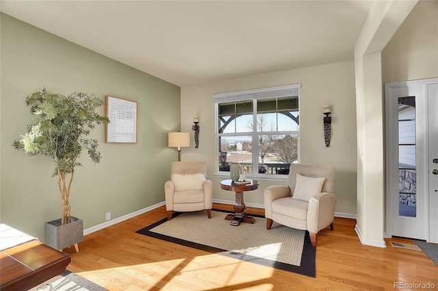 sitting room featuring light wood-style floors and baseboards