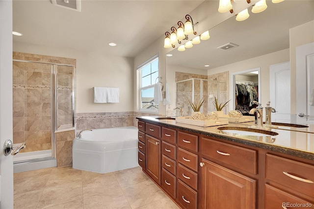 full bathroom featuring a sink, visible vents, a bath, and a shower stall