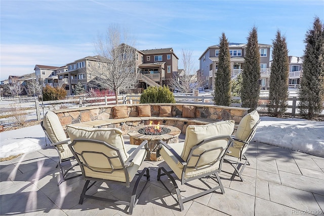 view of patio featuring a residential view and an outdoor fire pit