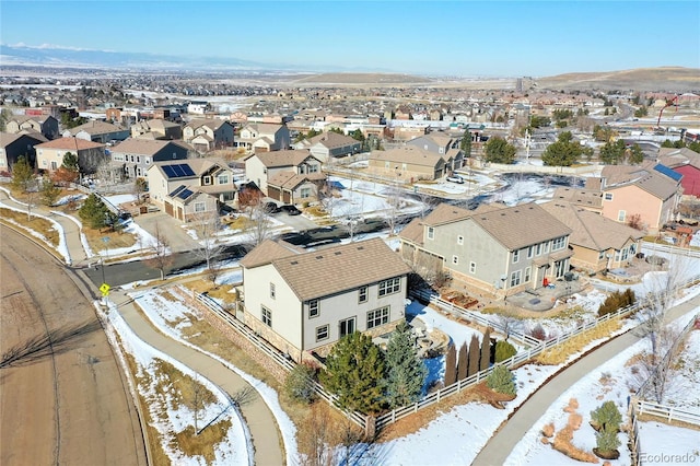 snowy aerial view featuring a residential view