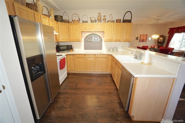 kitchen featuring light brown cabinets, hanging light fixtures, sink, stainless steel appliances, and dark hardwood / wood-style floors