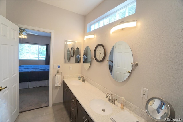 bathroom featuring ceiling fan, vanity, and tile patterned floors