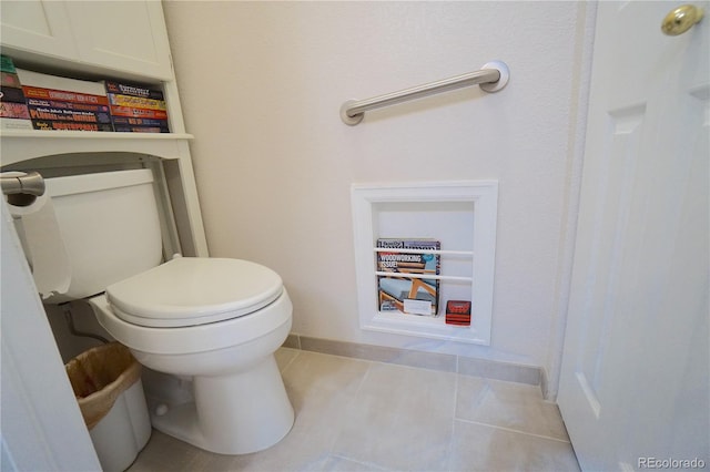 bathroom with toilet and tile patterned floors