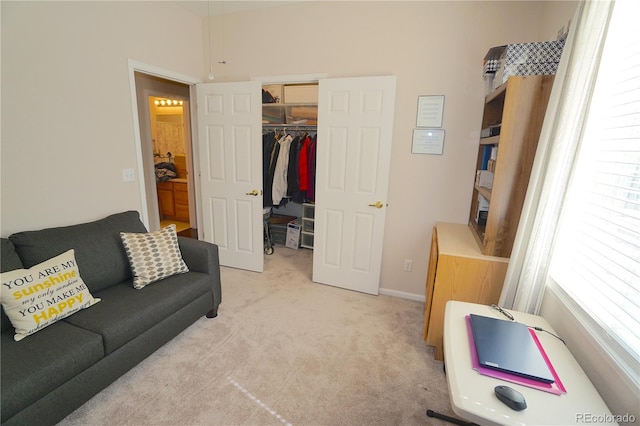 carpeted living room with a healthy amount of sunlight