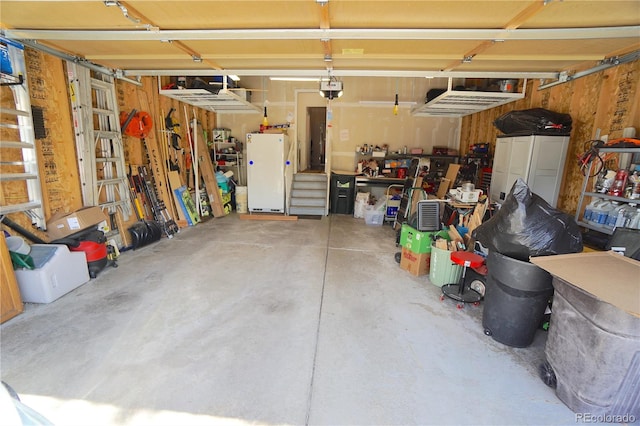 garage featuring white fridge