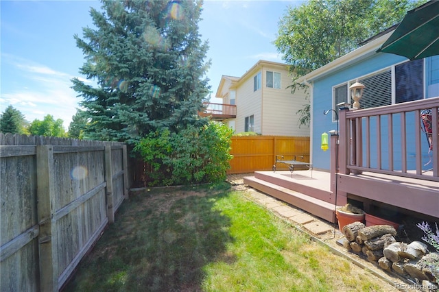 view of yard with a deck