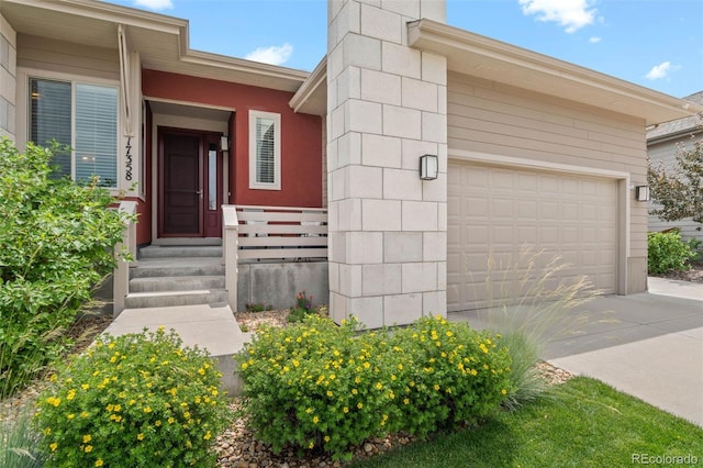 17358 W 95th Ave, Arvada, CO 80007 - doorway to property featuring driveway and an attached garage