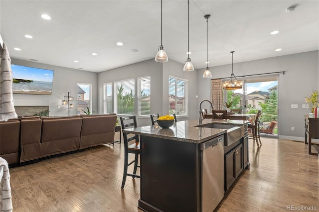 17358 W 95th Ave, Arvada, CO 80007 - kitchen featuring dishwasher, recessed lighting, light wood-style floors, dark stone countertops, and healthy amount of natural light