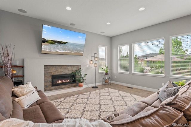 17358 W 95th Ave, Arvada, CO 80007 - living room with a fireplace, recessed lighting, and wood finished floors