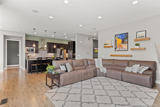 17358 W 95th Ave, Arvada, CO 80007 - living area with light wood finished floors and recessed lighting