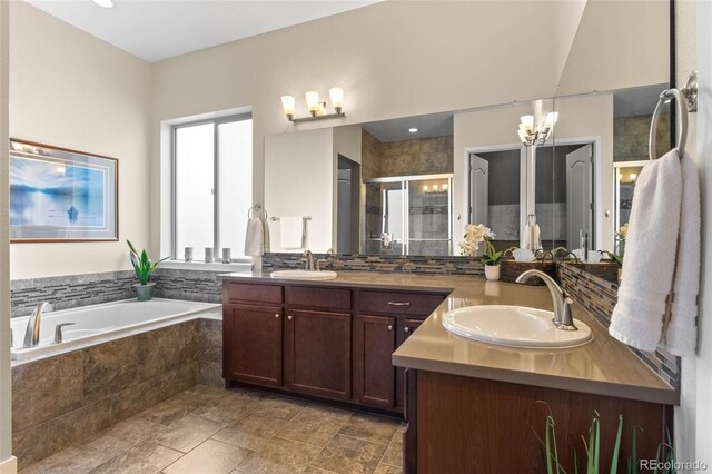 17358 W 95th Ave, Arvada, CO 80007 - full bath with two vanities, a shower stall, a bath, and stone finish floors