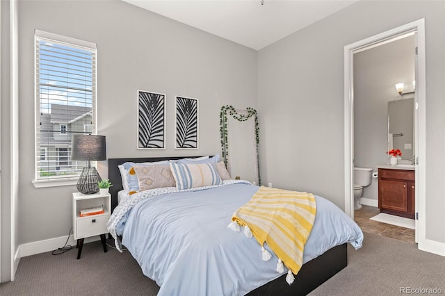 17358 W 95th Ave, Arvada, CO 80007 - bedroom featuring connected bathroom and carpet