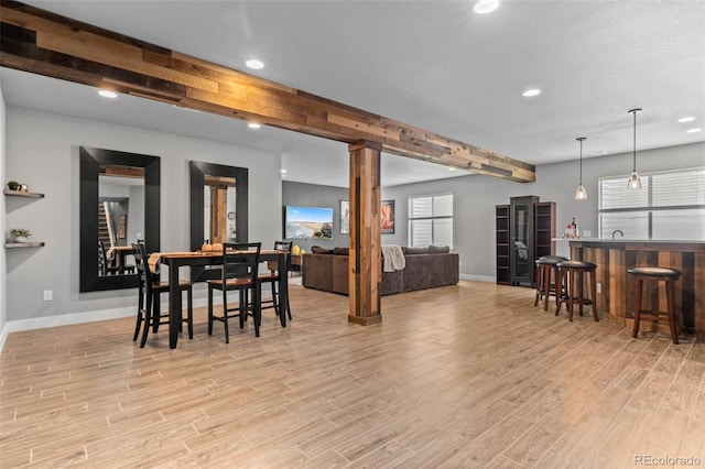 17358 W 95th Ave, Arvada, CO 80007 - dining area featuring recessed lighting, light wood finished floors, wet bar, and beam ceiling