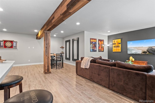17358 W 95th Ave, Arvada, CO 80007 - living room featuring ornate columns, light wood finished floors, and recessed lighting