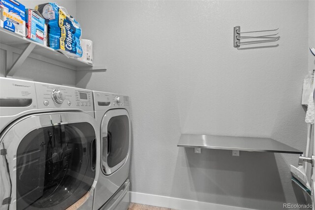 17358 W 95th Ave, Arvada, CO 80007 - laundry room featuring washing machine and clothes dryer